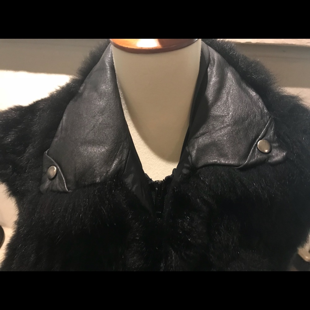 Fur zip up vest. Leather collar inside.
